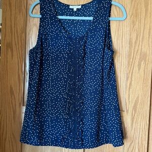 Navy blue with white polka dots tank top with scalloped detailing.